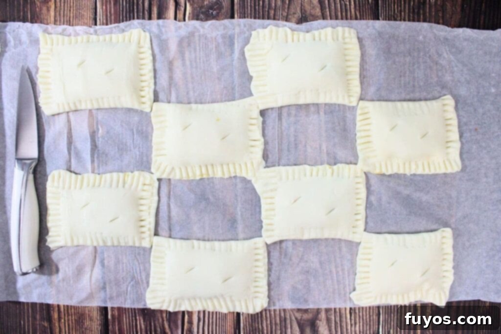 Autumn Air Fryer Pumpkin Puff Pastry Hand Pies 9 use a knife to cut slits in the tops of the pumpkin filled puff pastry