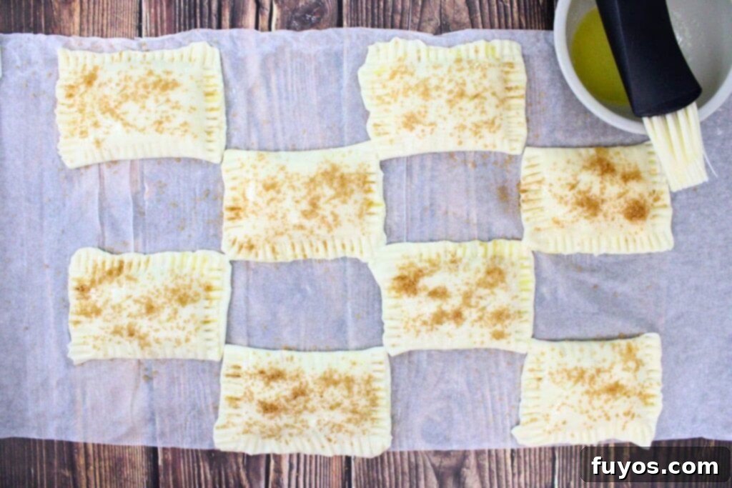 Autumn Air Fryer Pumpkin Puff Pastry Hand Pies 10 brush the tops of the pumpkin hand pies with melted butter cinnamon and sugar