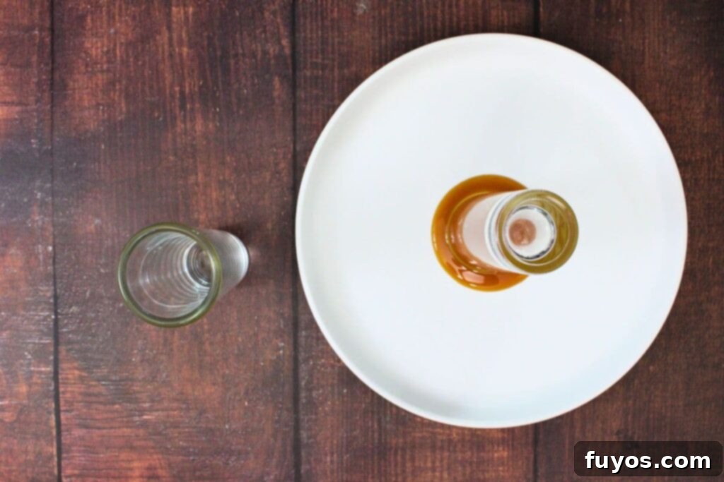 Simple Caramel Apple Crown Shot 5 place caramel syrup on a plate and rim your shot glass