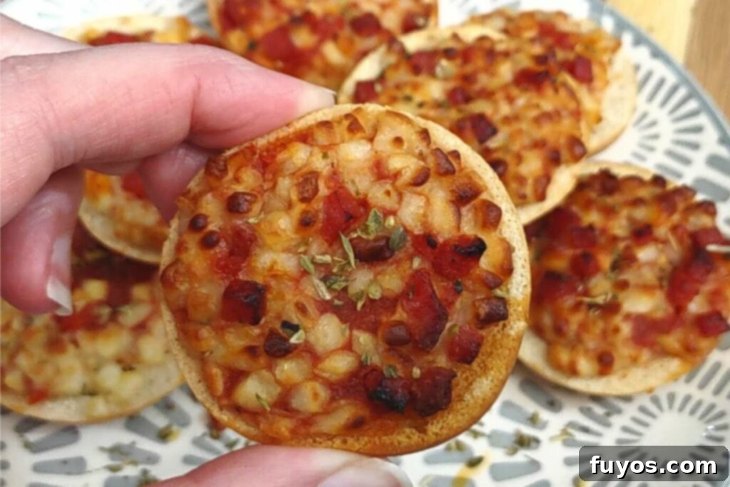 Crispy Air Fryer Bagel Bites 6 holding air fryer bagel bite