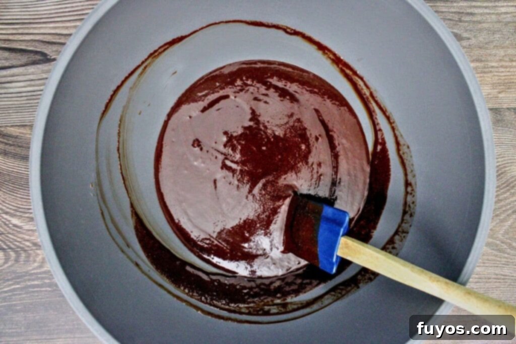 add sugar, red wine, and vanilla to the melted chocolate