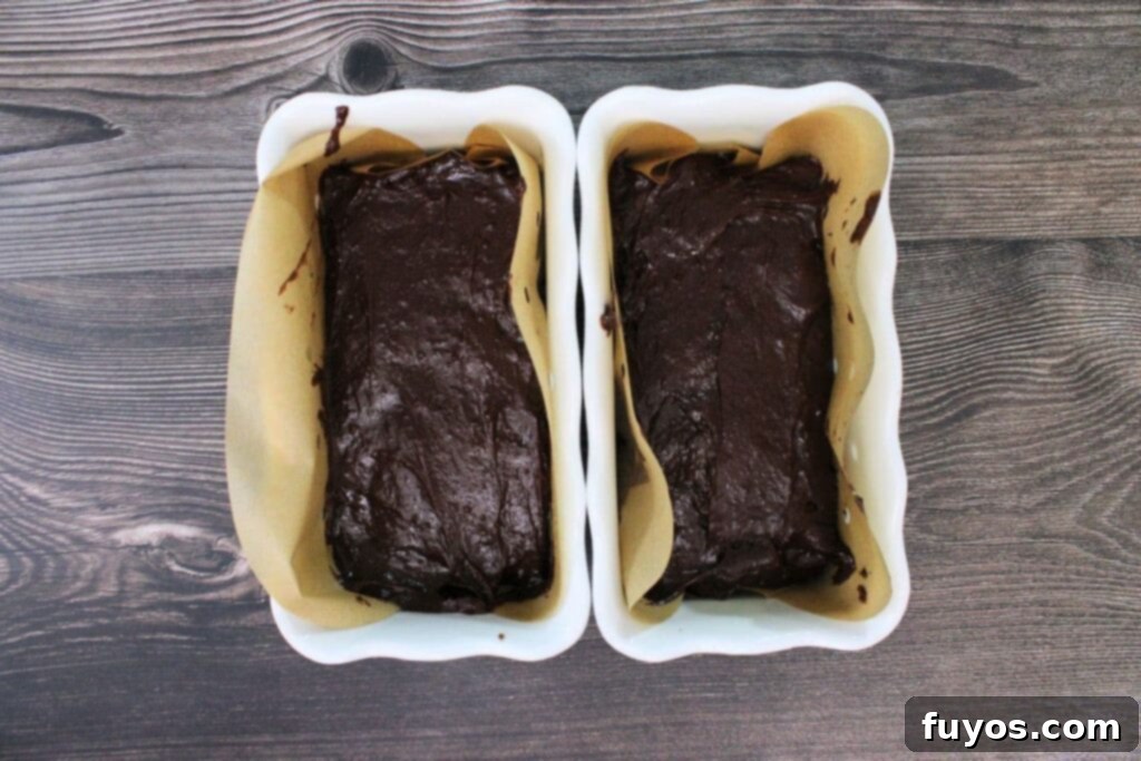 pour wine chocolate batter into greased baking dishes