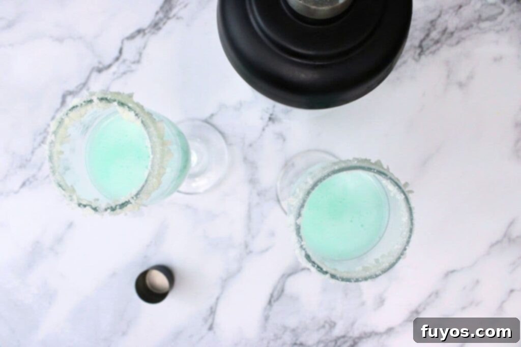 Jack Frost Mimosa Your Sparkling Winter Brunch Delight 7 shake and strain your blue mixture into champagne flutes