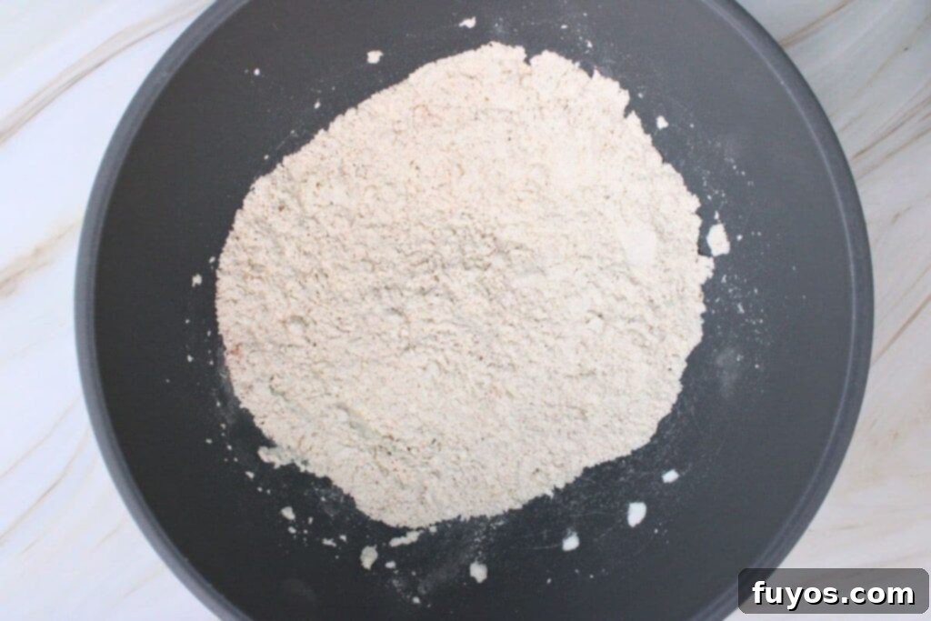 in a separate bowl combine cornstarch flour and seasonings