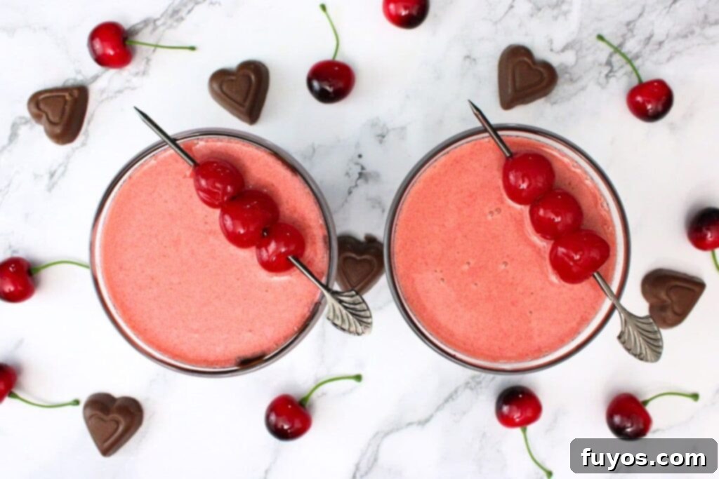 Indulge This Valentine's: Chocolate Covered Cherry Martini 8 overhead view of chocolate covered cherry martini drinks with chocolate and cherries surrounding