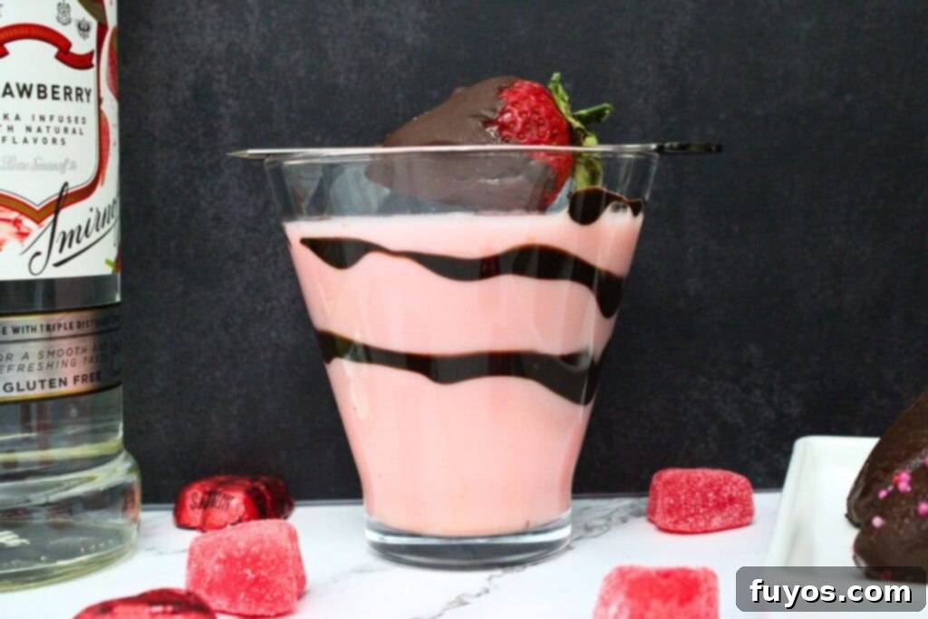 side view of chocolate covered strawberry martini with chocolate swirls