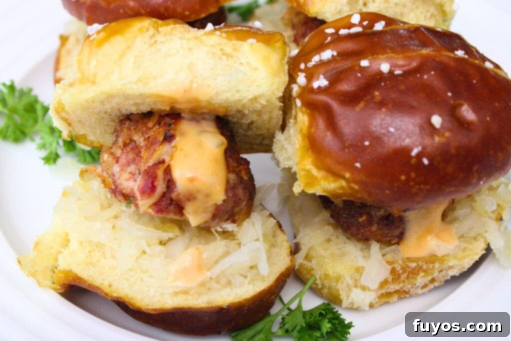 air fryer reuben meatballs with thousand island dressing on pretzel sliders