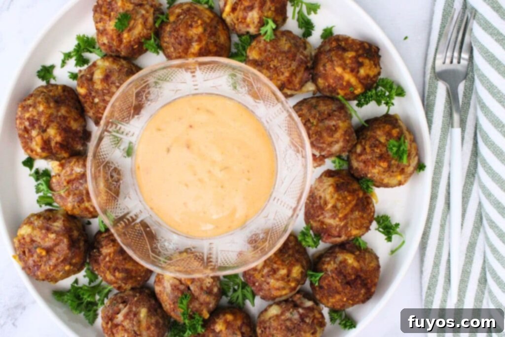 overhead view of reuben meatballs surrounding a bowl of thousand island dressing