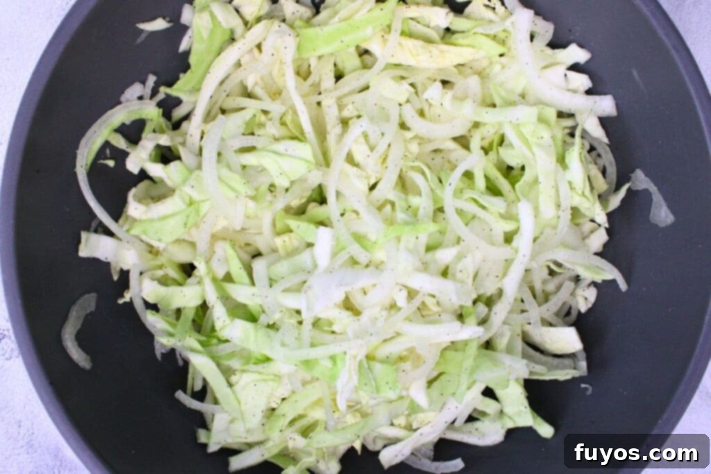 Easy 15-Minute Air Fryer Cabbage and Onions 6 toss shredded cabbage and onion with butter salt and pepper
