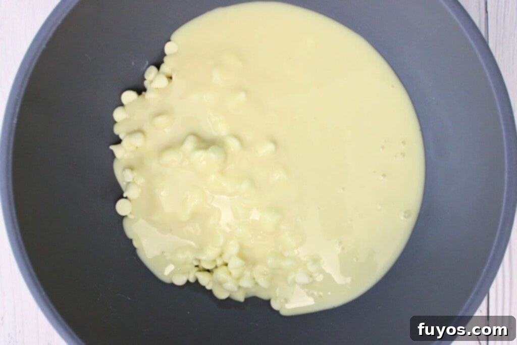 4 Ingredient Microwave Pistachio Fudge Delight 5 white chocolate chips and sweetened condensed milk in a microwave safe bowl, ready for melting