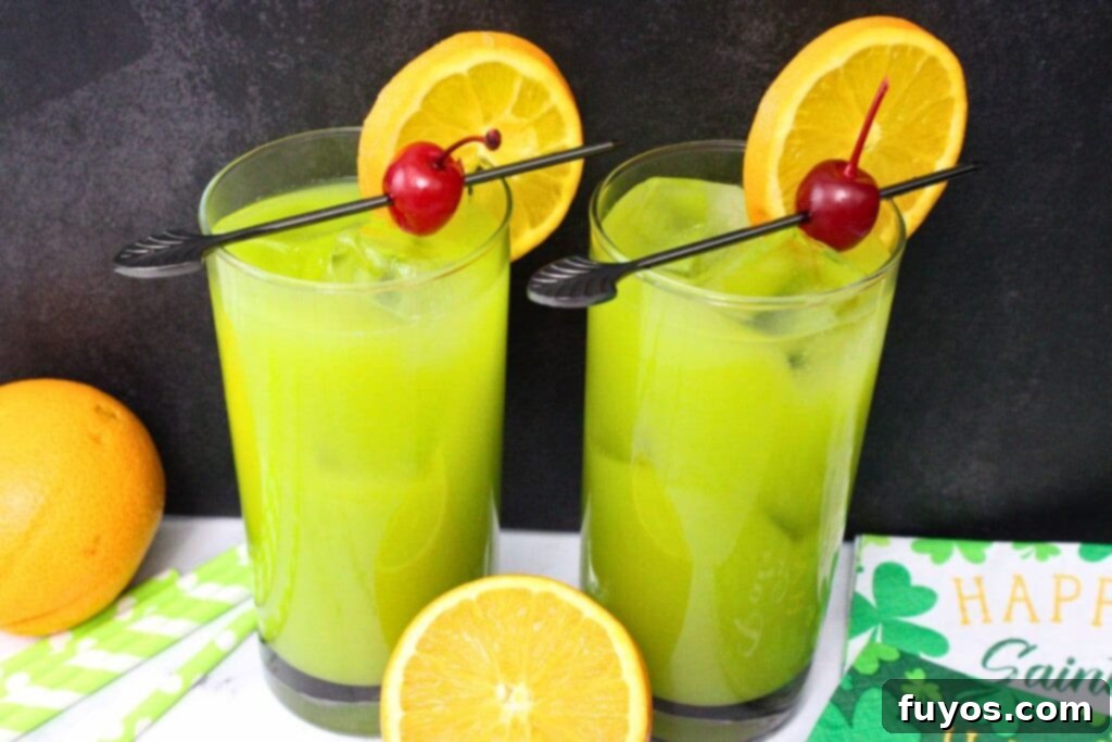St. Paddy's Drunken Leprechaun Irish Screwdriver 3 Two glasses of Drunken Leprechaun cocktails with fresh orange slices, ready to be served