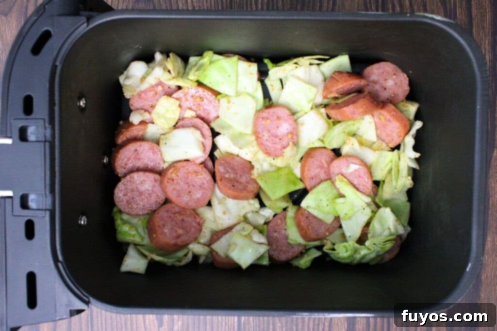 add sausage and cabbage mixture to air fryer basket