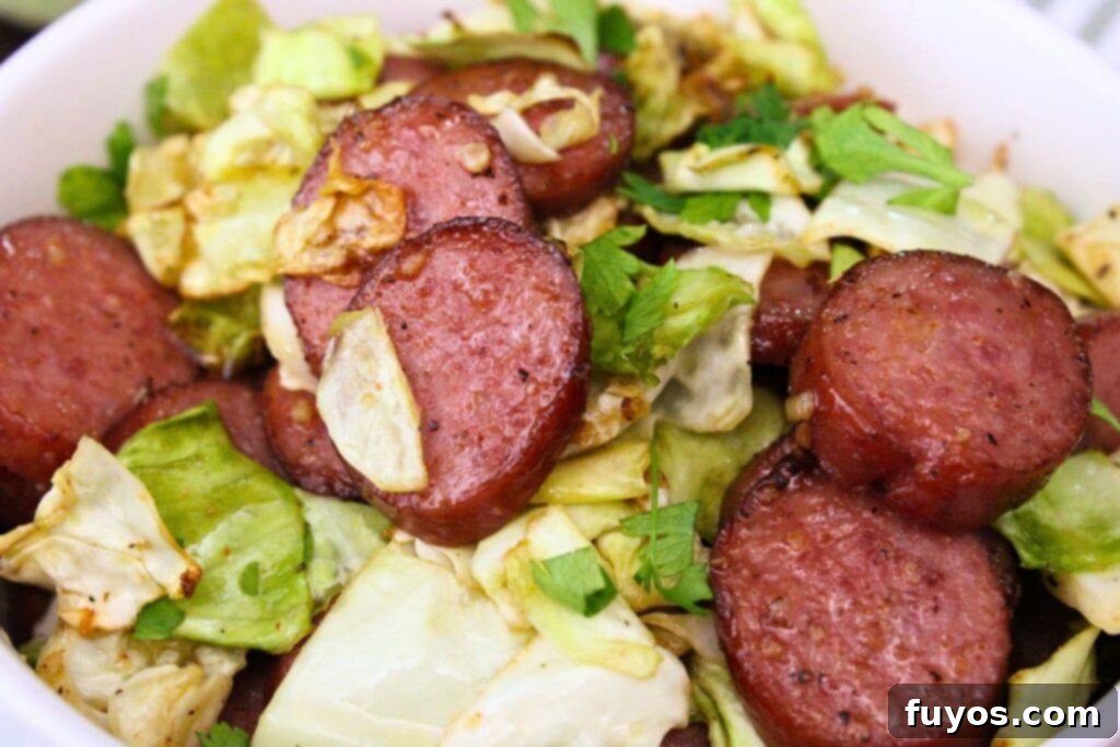 closeup view of air fryer cabbage and sausage in a bowl