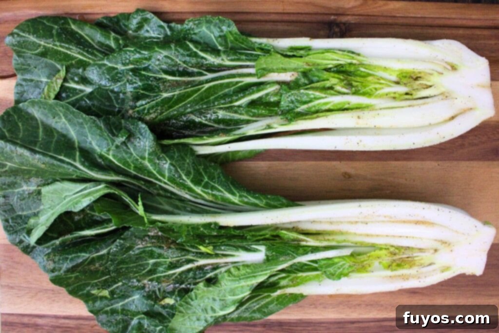 brush bok choy with olive oil, sesame oil, garlic powder, salt, pepper, and ginger mixture
