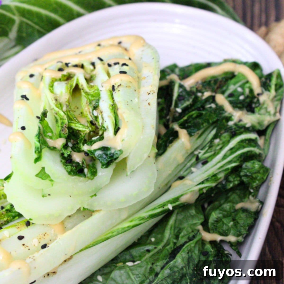 Air fryer bok choy recipe with sesame dressing, an Asian-inspired side