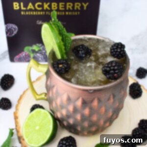Crown Royal Blackberry Kentucky Mule cocktail with fresh fruit.