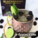 Crown Royal Blackberry Kentucky Mule cocktail with fresh fruit.