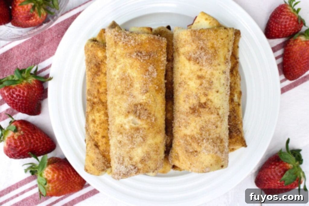 overhead view of air fryer cheesecake chimichangas on a plate