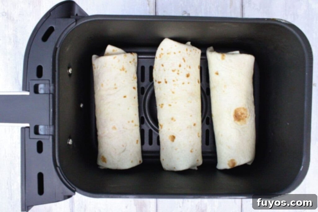 place chimichangas in preheated air fryer basket