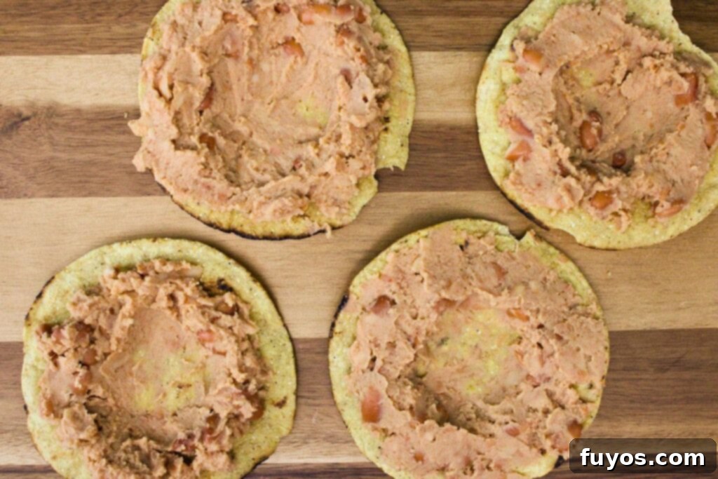 Air Fried Huevos Rancheros Zesty Mexican Breakfast 6 spread refried beans on tostadas forming a small bowl