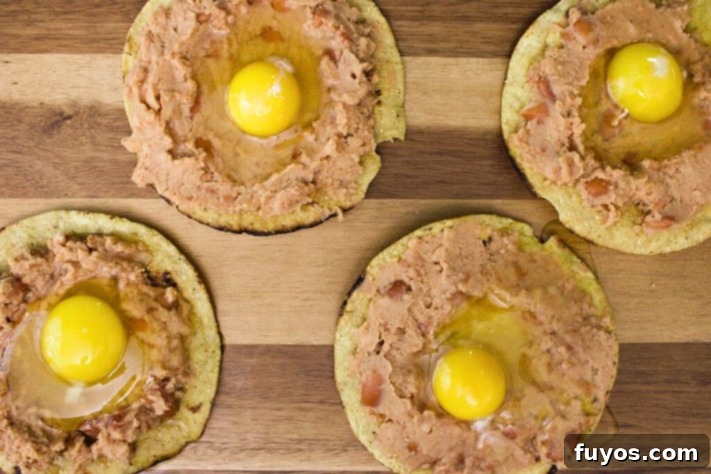 Air Fried Huevos Rancheros Zesty Mexican Breakfast 7 crack an egg in the center of each tostada
