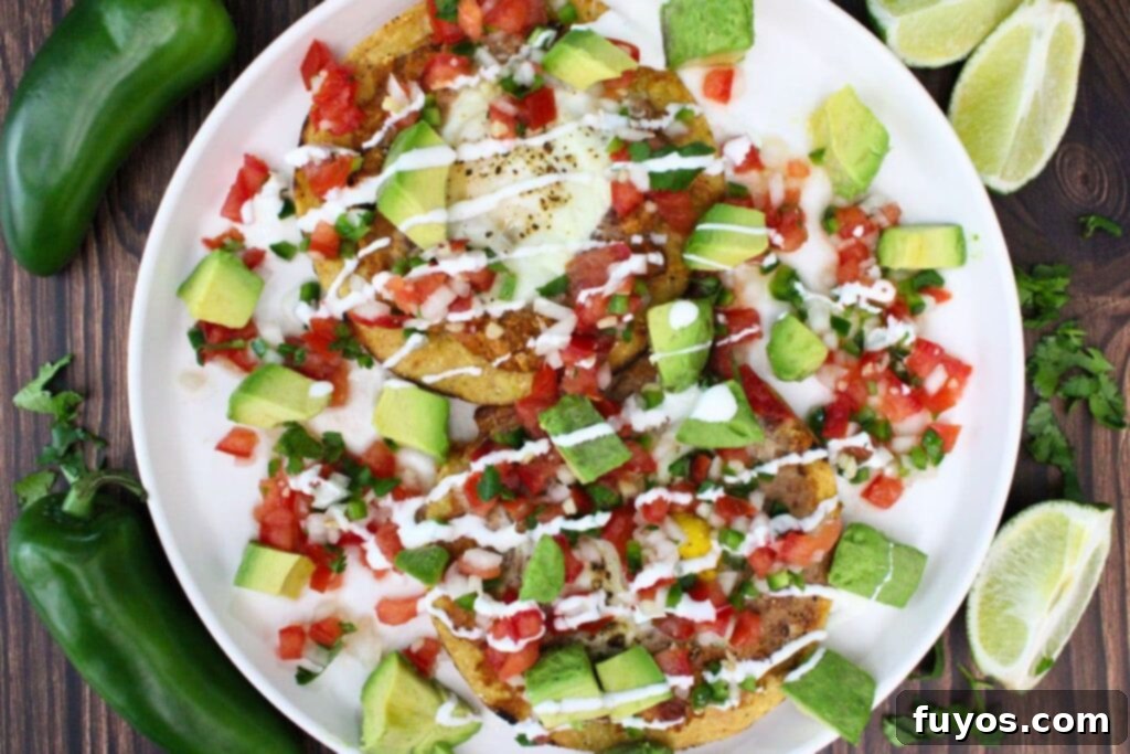 Air Fried Huevos Rancheros Zesty Mexican Breakfast 9 overhead view of air fryer huevos rancheros topped with pico de gallo and avocado
