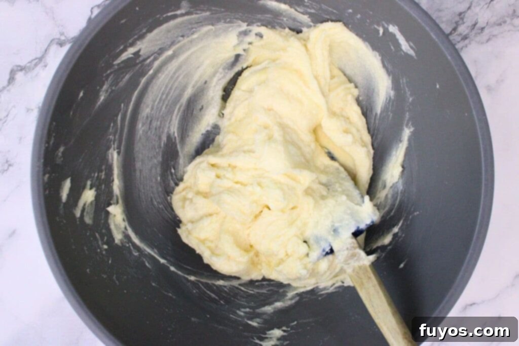 combine softened cream cheese, granulated sugar, and vanilla in a bowl