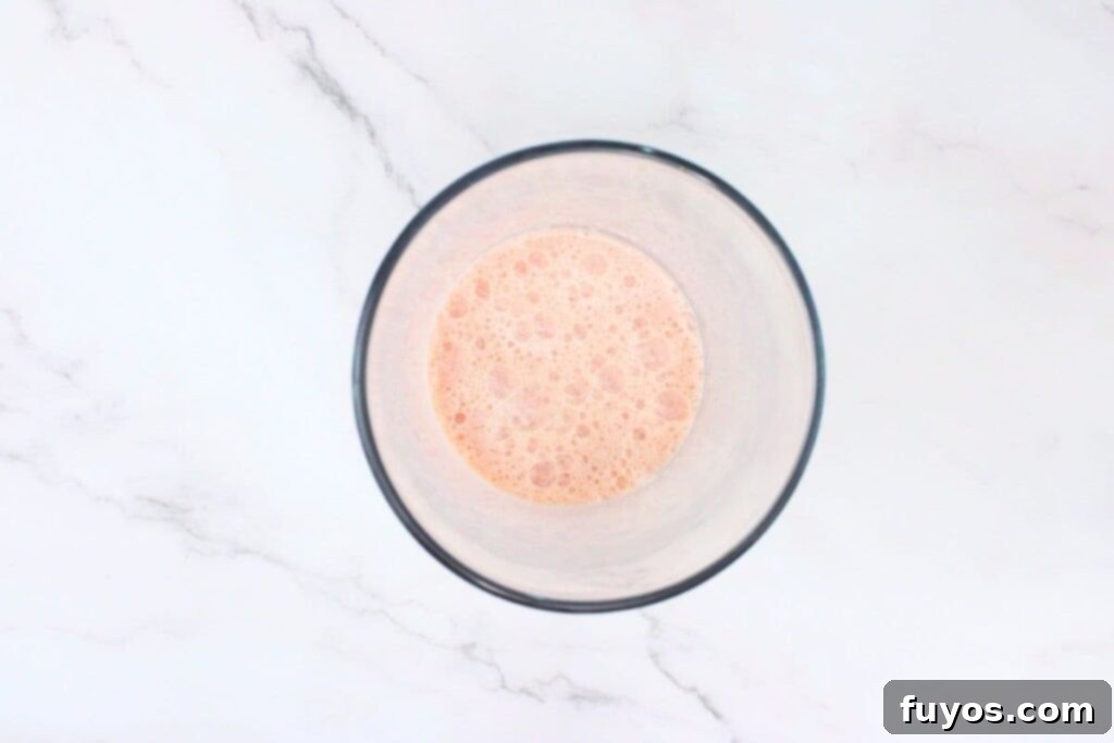 Dutch Bros Inspired Strawberry Horchata Chai 6 Stirring or shaking the strawberry horchata chai ingredients until all the syrups are perfectly blended into the drink.