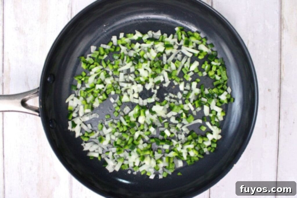 add oil and soften diced poblano and onion in a skillet