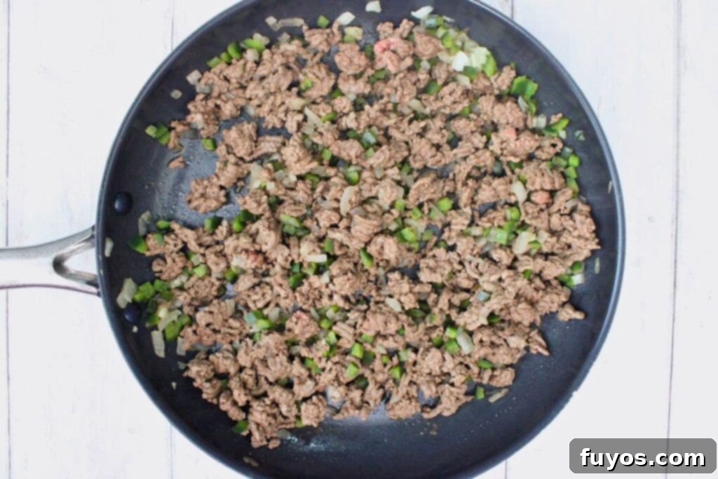 add ground beef to skillet and break it up as it cooks