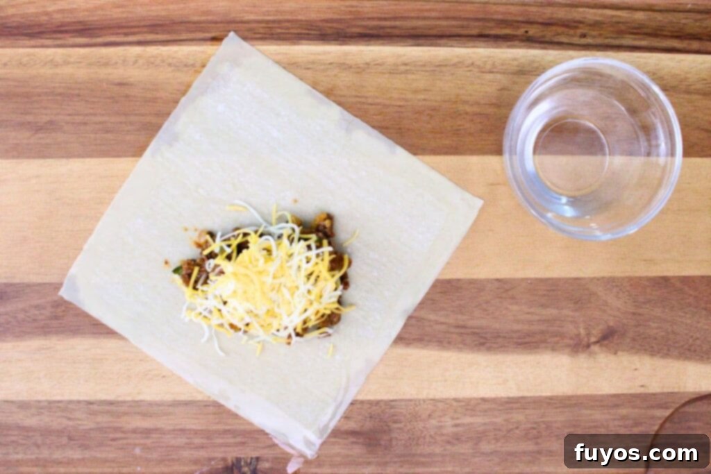 wet the edges of the egg roll wrapper with your finger
