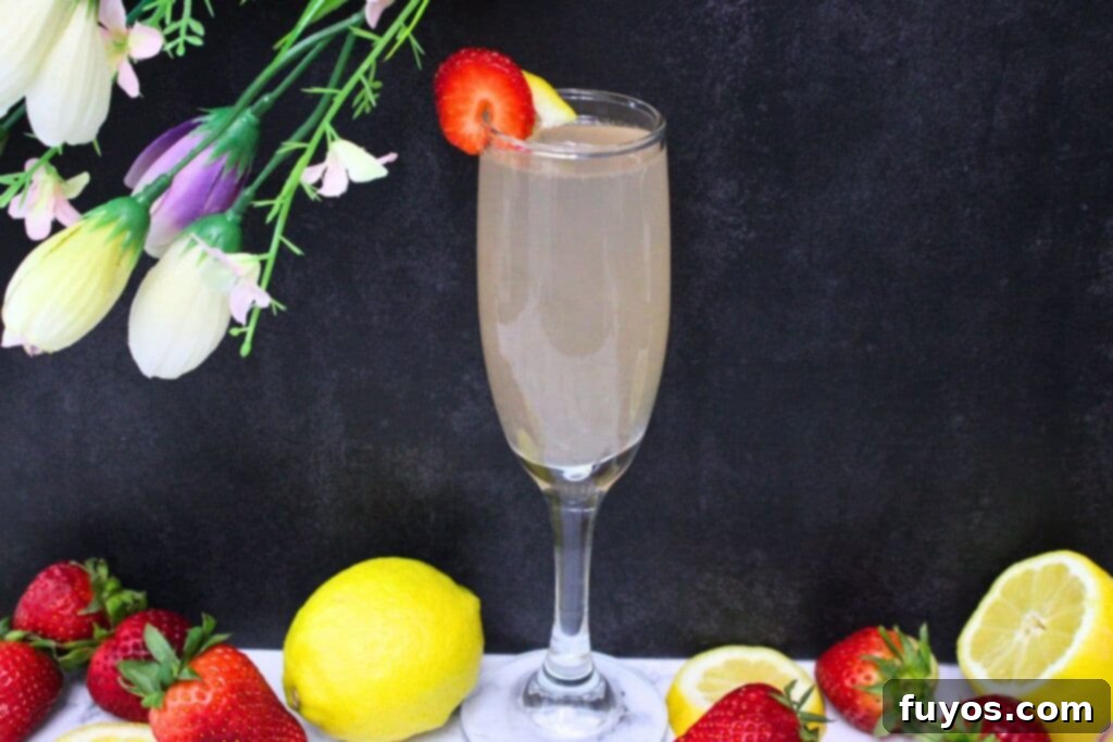 Pink Whitney Infused Strawberry Pink Lemonade Mimosa 8 A beautifully arranged setting with a pink lemonade mimosa, fresh fruit, and delicate flowers, creating a sophisticated and inviting ambiance for a special occasion.