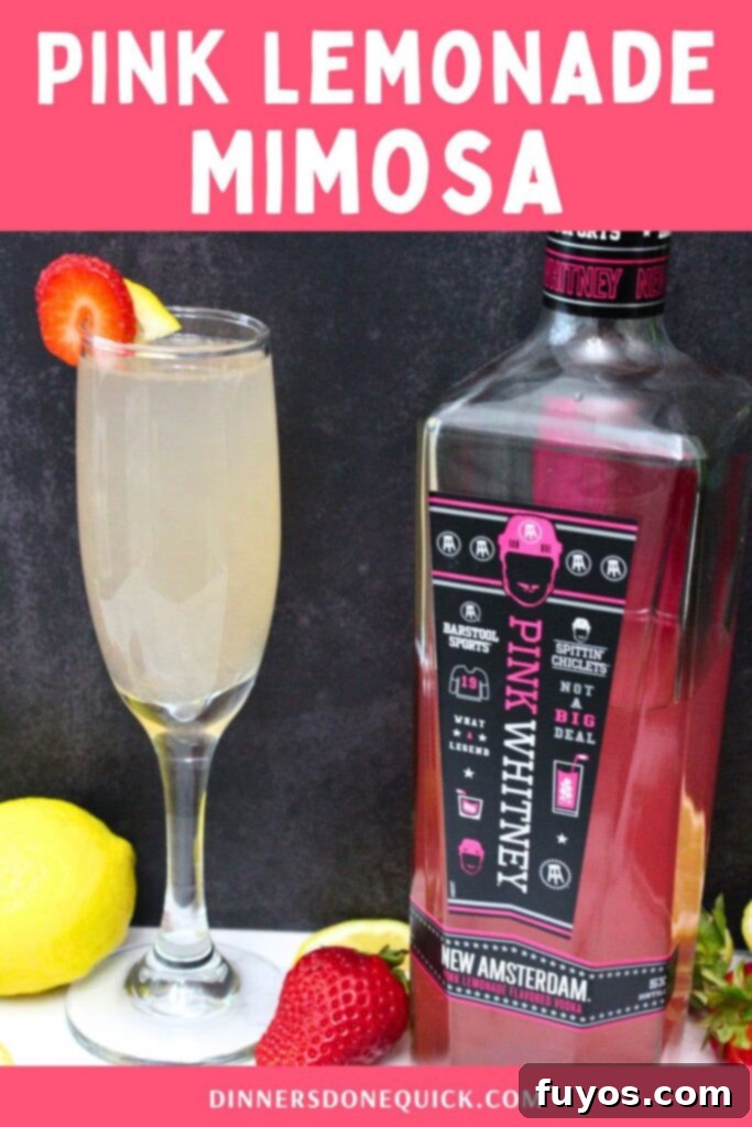 Pink Whitney Infused Strawberry Pink Lemonade Mimosa 11 A Pinterest-friendly image showing a pink lemonade mimosa with fresh fruit and flowers.