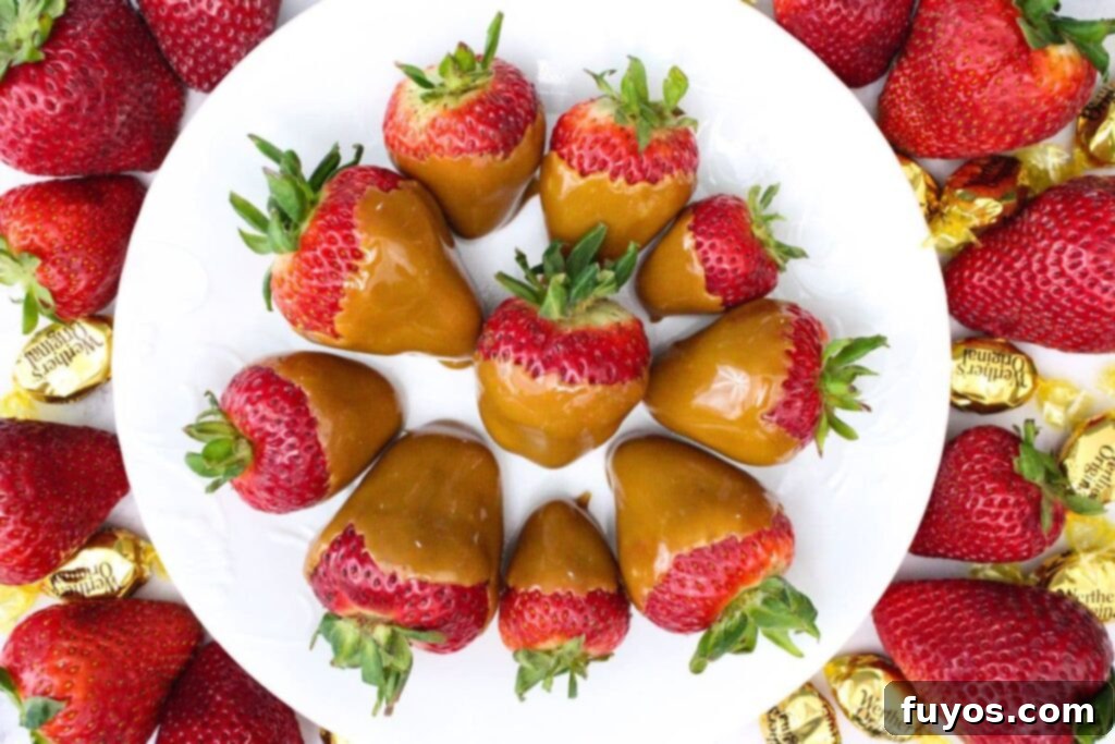 Two Ingredient Caramel Strawberry Delight 9 overhead view of several caramel candied coated strawberries circling a plate