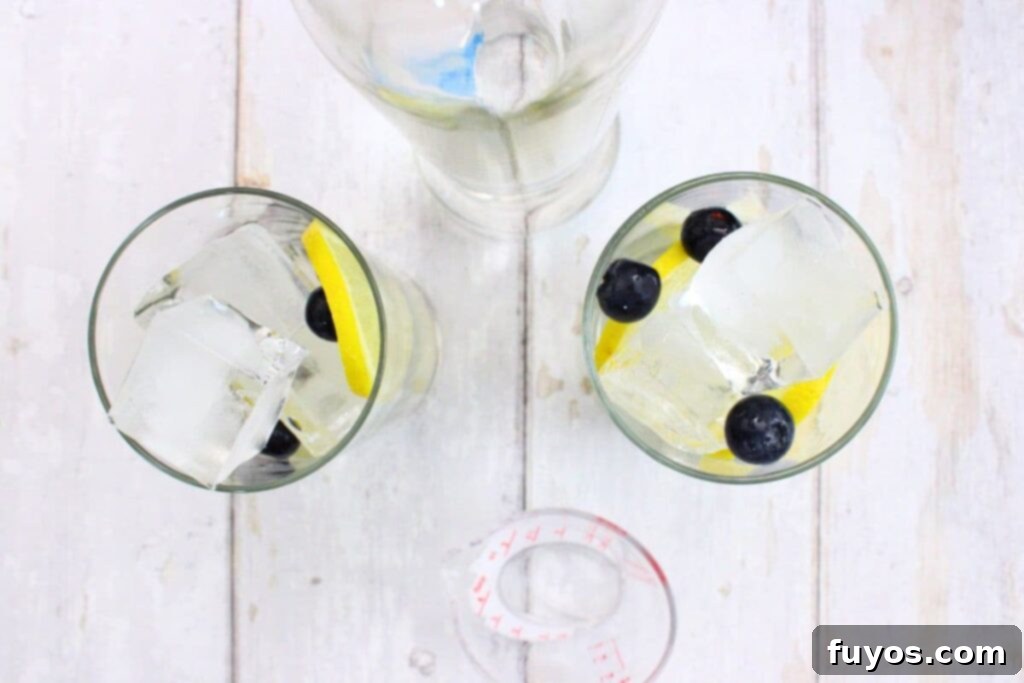 add vodka over the blueberries and lemon