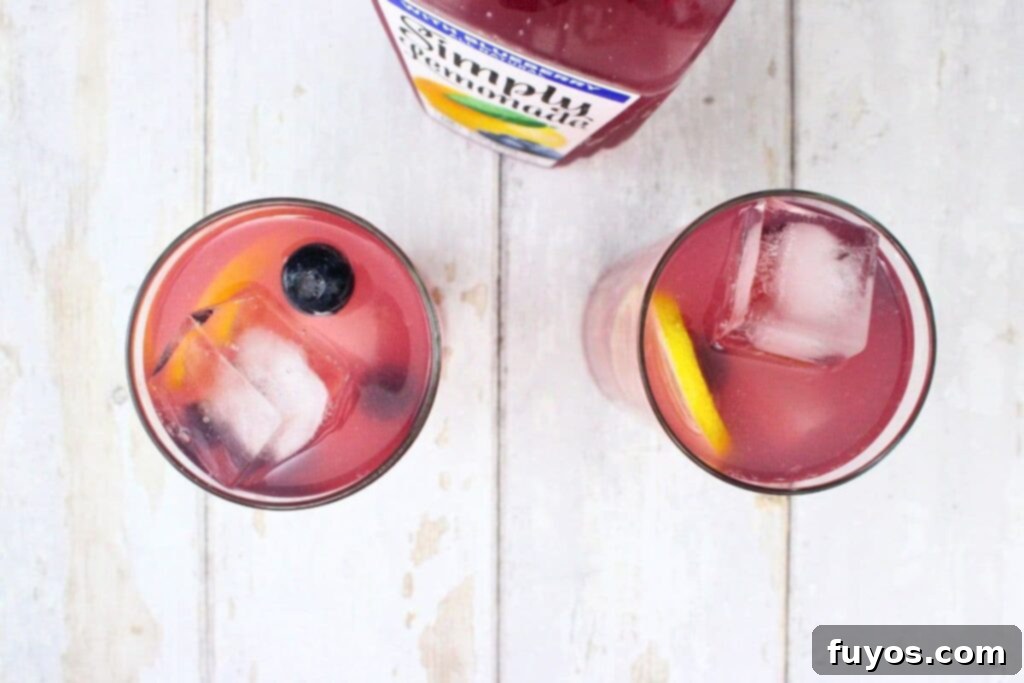 top off blueberries and lemon with lemonade