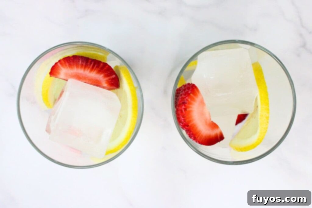 Easy Summer Strawberry Vodka Lemonade Recipe 5 fill a highball glass with ice, strawberries, and lemon