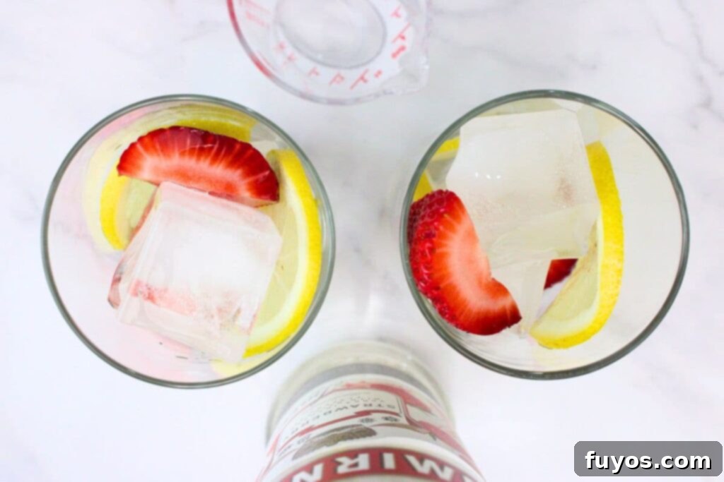 Easy Summer Strawberry Vodka Lemonade Recipe 6 pour strawberry vodka into the highball glass