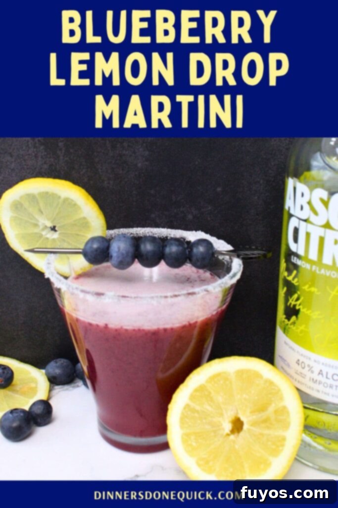 A stunning shot of a blueberry lemon drop martini, perfect for sharing on Pinterest.