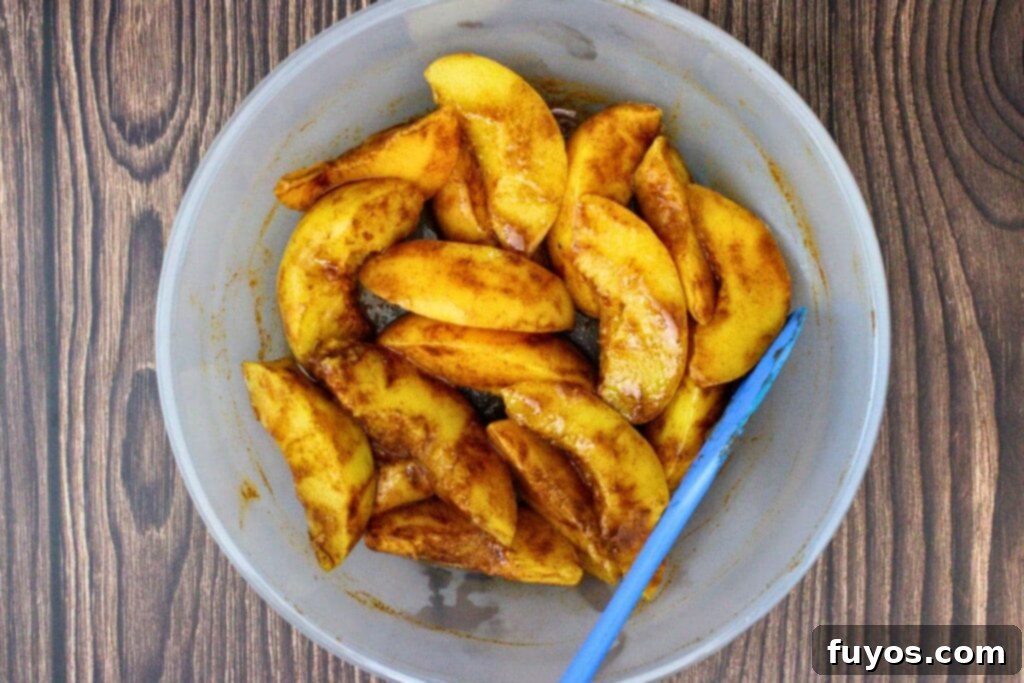 Step 1: Drained peaches, vanilla, and cinnamon are added to a microwave-safe dish and stirred together.