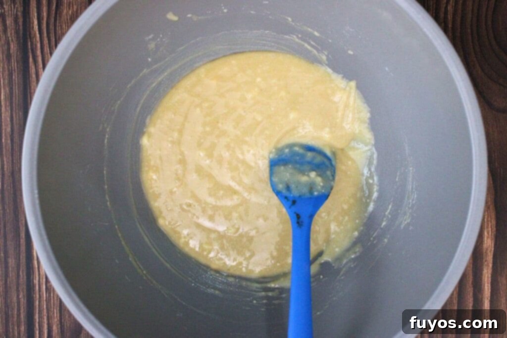 Step 2: Bisquick, brown sugar, melted butter, and milk are mixed in a small bowl until a smooth batter forms.