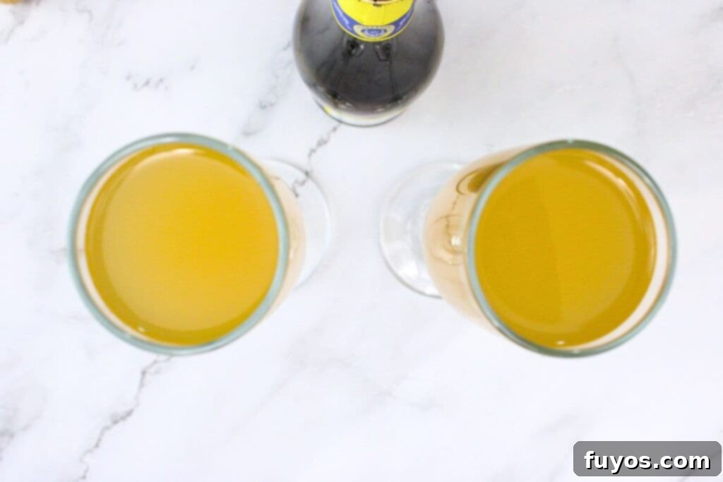 add chilled prosecco over peach whiskey
