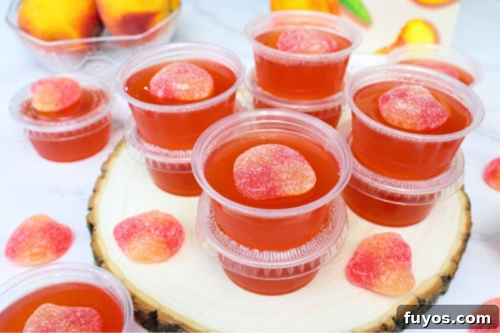 Effortless Crown Peach Jello Shots With Only Four Ingredients 10 crown royal peach jello shooters stacked up on a counter
