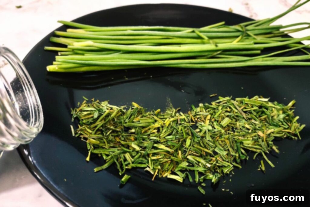 Effortless Air Fryer Chive Preservation 9 air fryer dried chives spread out across a plate