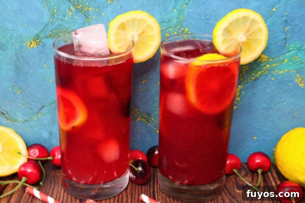 Effortless Cherry Vodka Lemonade 9 two cherry vodka lemonade cocktails with lemon slices in the rim