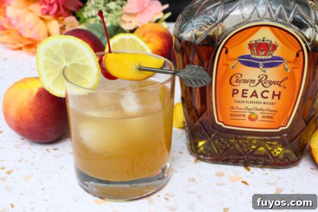crown royal peach whiskey sour sitting next to the bottle