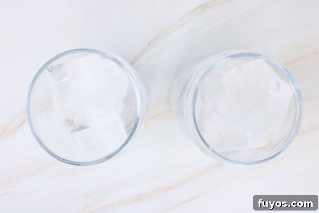 fill peach whisky and cream soda glass with ice