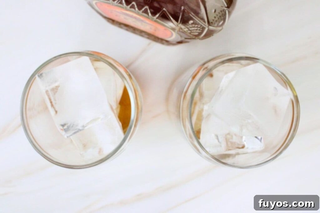 add crown royal peach whisky over ice cubes