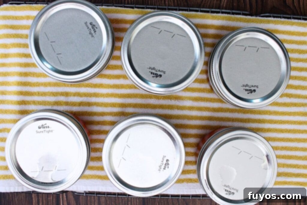 remove jars from boiling water and cool on a towel covered rack