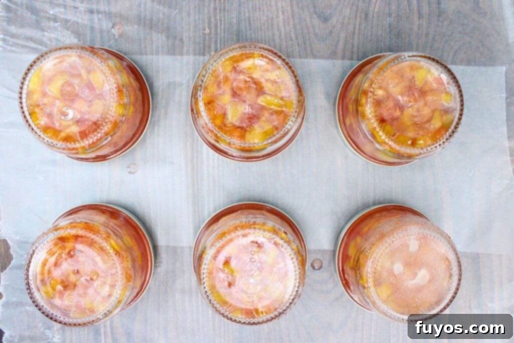 invert the jars so the peach jam can touch the lid